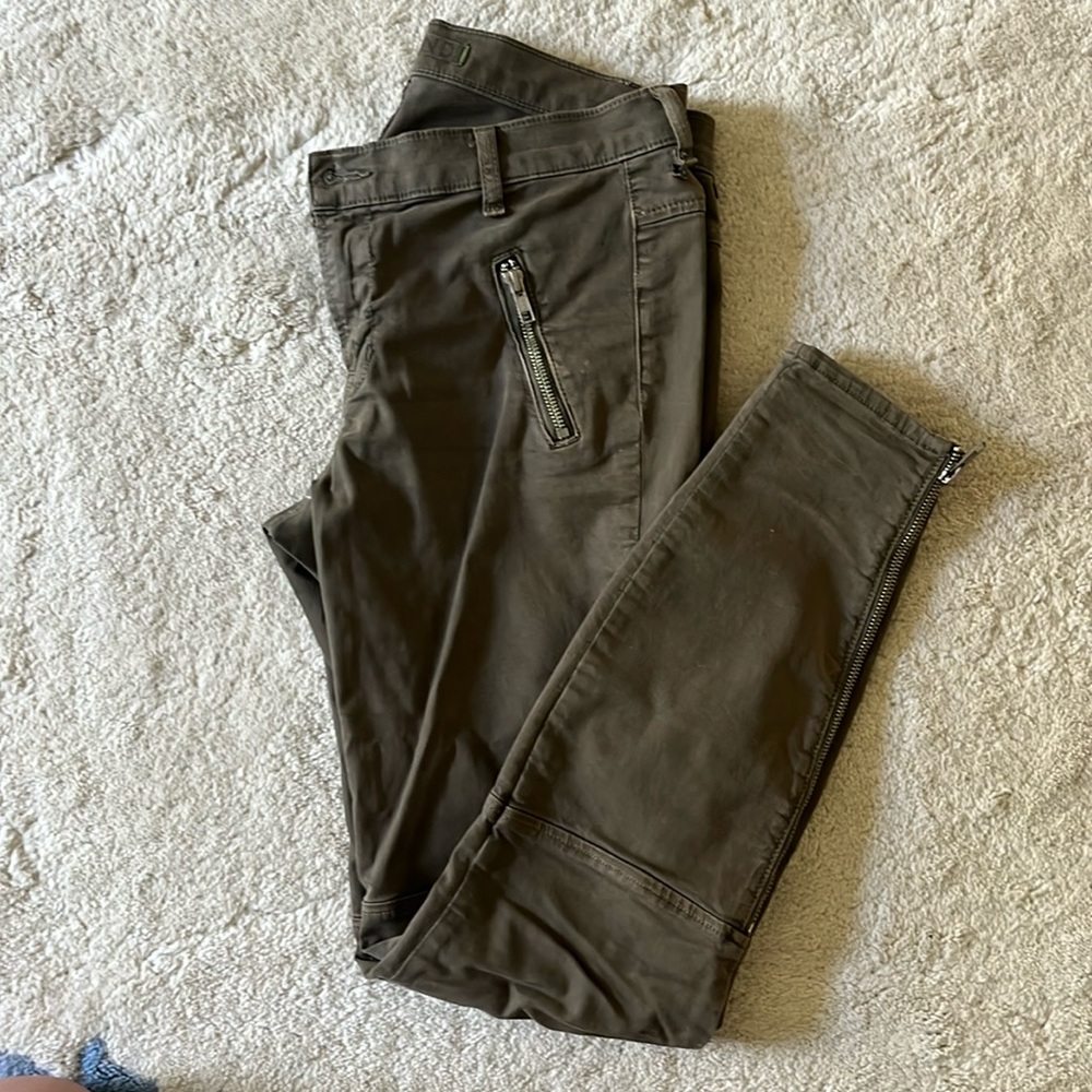 J Brand hunter green stretchy jeans with zippers and a skinny ankle.